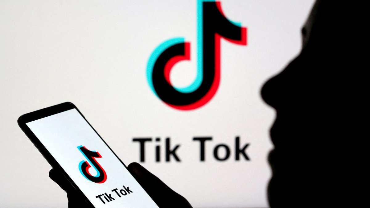A person holds a smartphone with TikTok logo displayed in this picture illustration taken Nov. 7, 2019. (Reuters Photo)