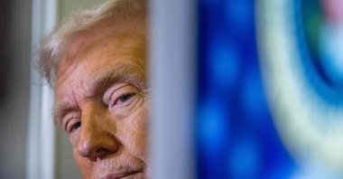 U.S. President Donald Trump speaks to journalists aboard Air Force One as he travels from West Palm Beach back to Washington, U.S., March 9, 2025. (AFP Photo)