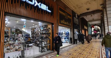 Tunisians walk in a commercial area in central Tunis, Tunisia, March 7, 2025. (AFP Photo)