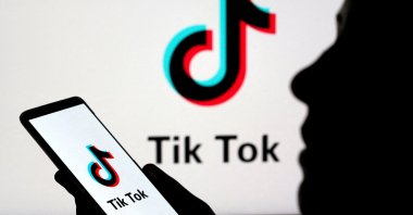 A person holds a smartphone with TikTok logo displayed in this picture illustration taken Nov. 7, 2019. (Reuters Photo)