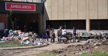 People clean up outside the Jose Penna Interzonal Hospital after a flood struck the city of Bahia Blanca, Argentina, March 9, 2025. (Reuters Photo)