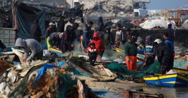 Palestinians gather with fishermen at the port of Gaza City, Palestine, March 9, 2025. (AFP Photo)