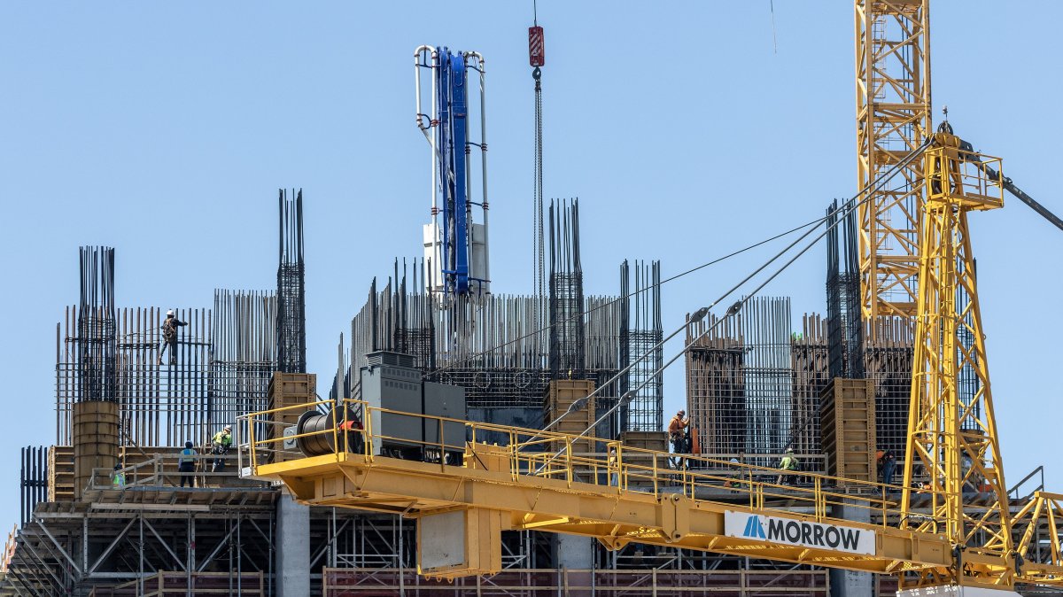 Workers install steel structures at a construction site in Downtown Miami, Florida, March 11, 2025. (EPA Photo)