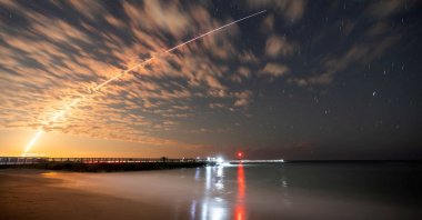 The SpaceX Falcon 9 rocket carrying Starlink satellites is seen over Sebastian Inlet after launching from Cape Canaveral, Florida, U.S., Feb. 26, 2025. (Reuters Photo)