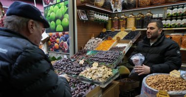 A man shops at a dry fruits store in the bustling Eminönü neighborhood of Istanbul, Türkiye, Feb. 27, 2025. (IHA Photo)