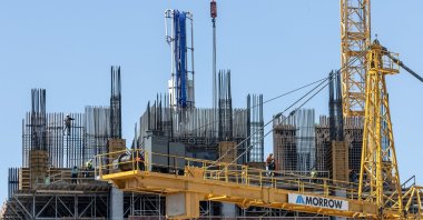 Workers install steel structures at a construction site in Downtown Miami, Florida, March 11, 2025. (EPA Photo)