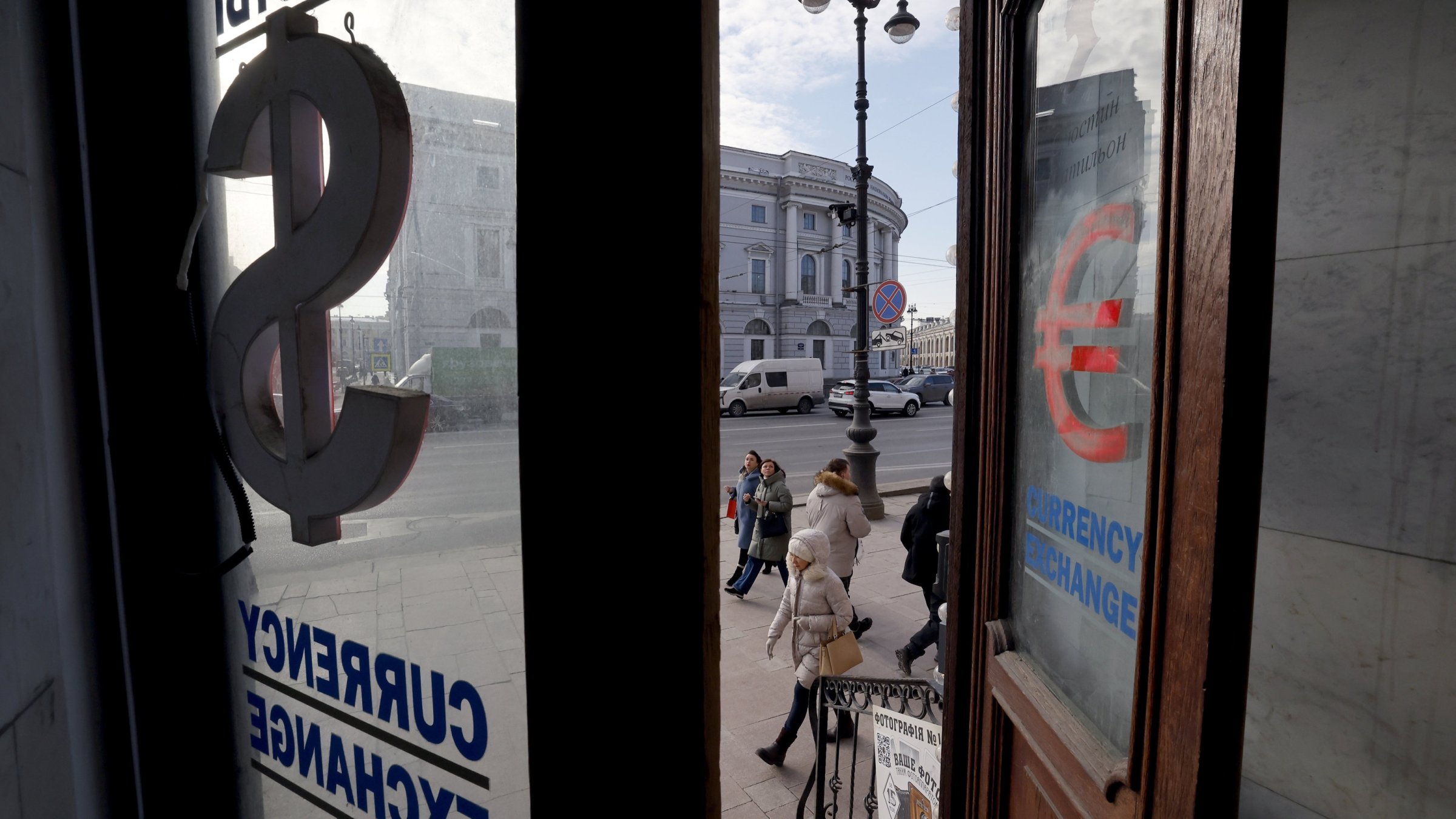 People walk past a currency exchange office at the Nevsky Prospect Avenue in St. Petersburg, Russia, Feb. 26, 2025. (EPA Photo)