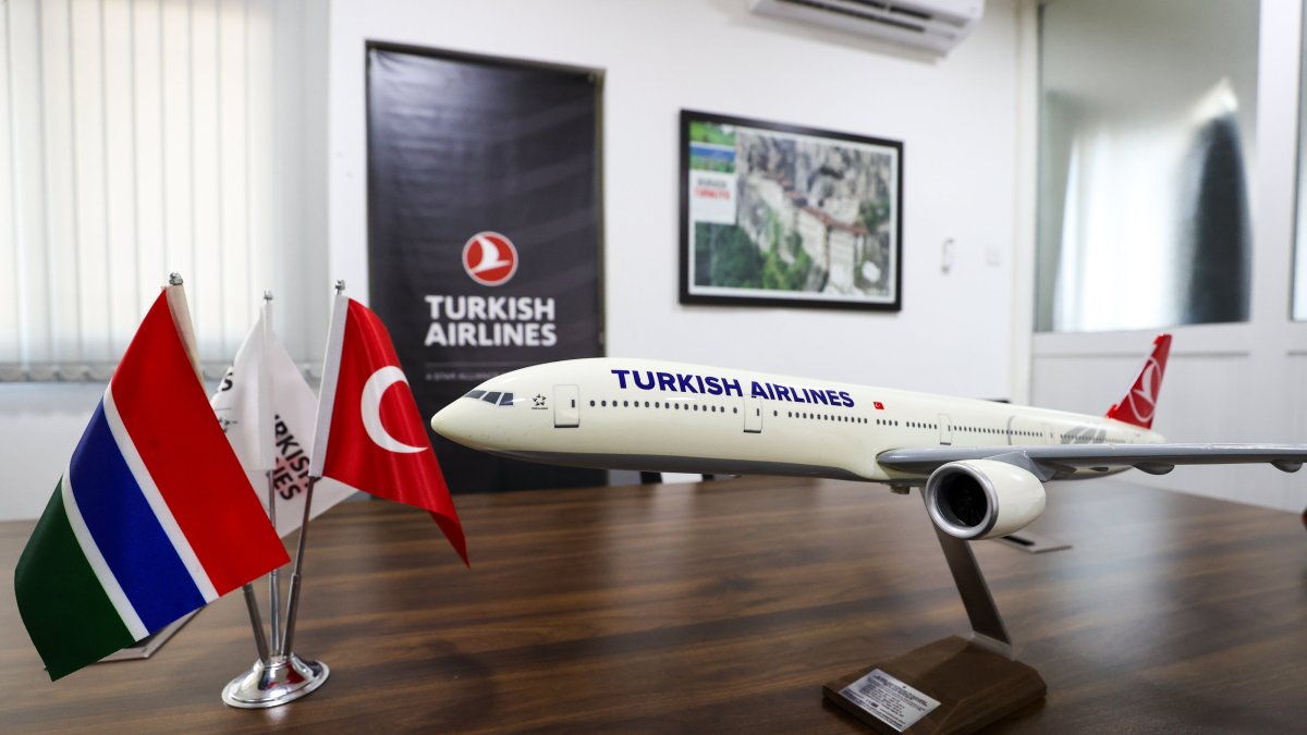 The flags of Gambia and Türkiye, along with a model of Turkish Airlines, are seen at an undisclosed location on March 11, 2025. (AA Photo)