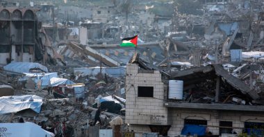 A Palestinian flag flutters amid the ruins of buildings in Beit Lahia in the northern Gaza Strip, Gaza, Palestine, March 4, 2025. (AFP Photo)