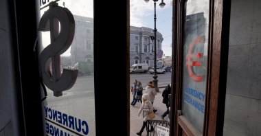 People walk past a currency exchange office at the Nevsky Prospect Avenue in St. Petersburg, Russia, Feb. 26, 2025. (EPA Photo)