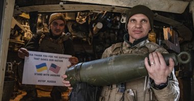 Ukrainian Soldiers hold a poster thanking the U.S. for support at the front line near Toretsk, Donetsk region, Ukraine, March 11, 2025. (AP Photo)