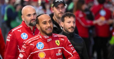 British Formula One driver Lewis Hamilton signs autographs during the Scuderia Ferrari HP Drivers&#039; presentation event by Unicredit, in Piazza Castello, Milan, Italy, March 6, 2025. (AFP Photo)