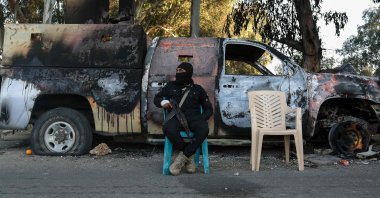 A member of the security forces loyal to the interim Syrian government guards a checkpoint previously held by supporters of deposed president Bashar Assad, in the town of Hmeimim, in the coastal province of Latakia, Syria, March 11, 2025. (AFP Photo)