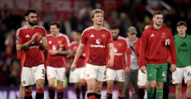Bruno Fernandes (L) and teammates of Manchester United walk on the pitch after the English Premier League match between Manchester United and Arsenal FC, Manchester, U.K., March 9, 2025. (EPA Photo)