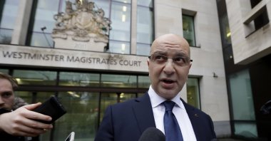 Akın Ipek, a prominent member of FETÖ, speaks to media as he leaves Westminster Magistrates Court after his extradition hearing was dismissed, London, U.K., Nov. 28, 2018. (AP Photo)