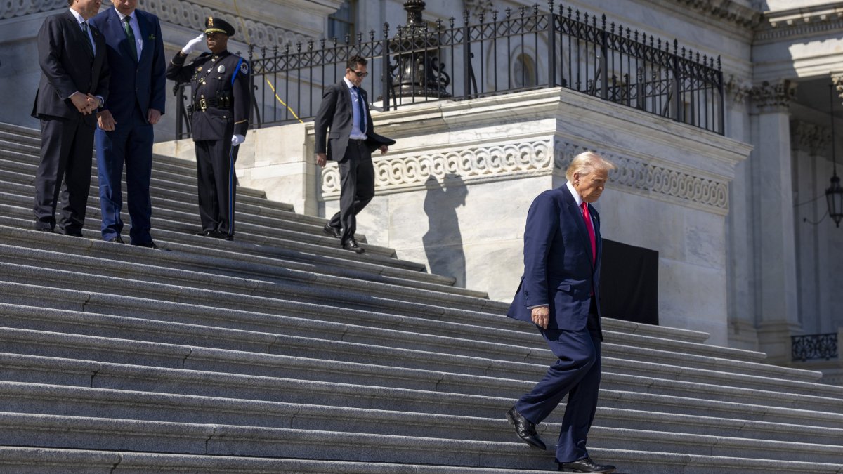 U.S. President Donald Trump (R) departs the Capitol as Speaker of the House Mike Johnson (L) and the Taoiseach of Ireland Micheal Martin (R) look on following the Friends of Ireland Luncheon at the U.S. Capitol in Washington, U.S., March 12, 2025. (EPA Photo)