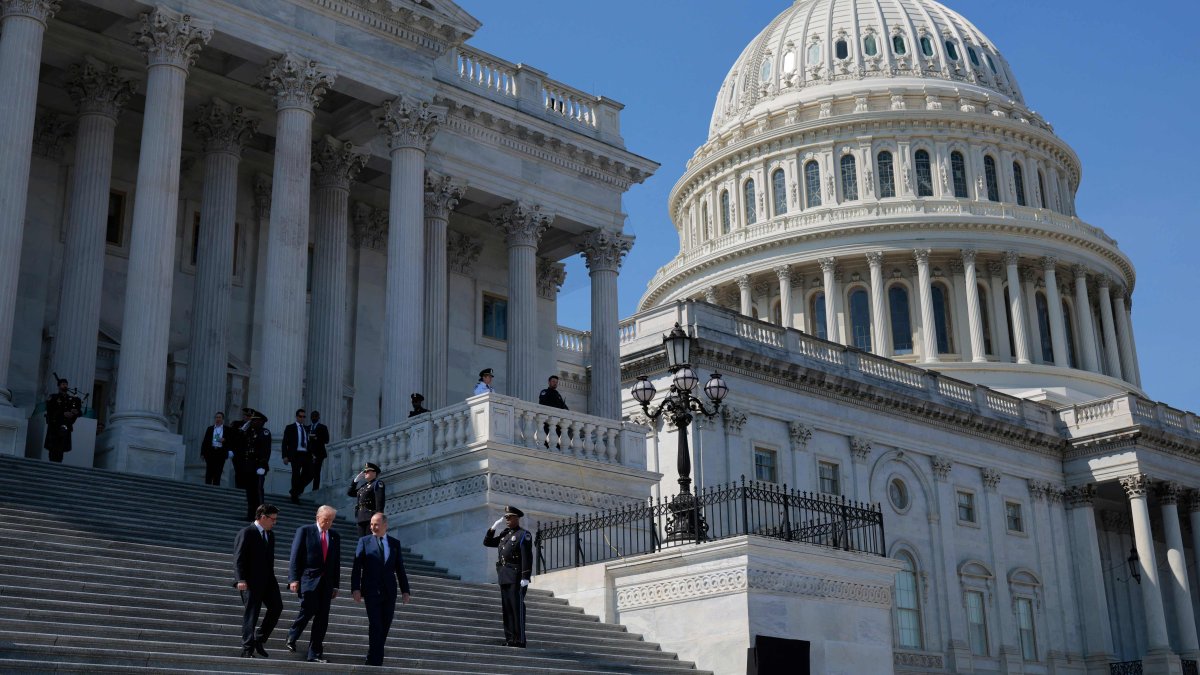 A general view as (L-R) House Speaker Mike Johnson, U.S. President Donald Trump and Irish Taoiseach Micheal Martin depart the U.S. Capitol following a &quot;Friends of Ireland&quot; luncheon, Washington, U.S., March 12, 2025 (Getty Images via AFP Photo)
