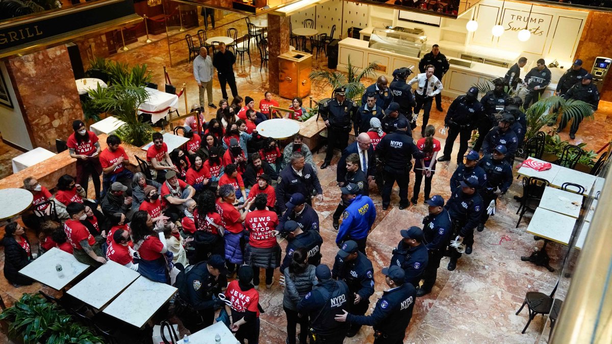 Demonstrators from the human rights organization Jewish Voice for Peace are detained by NYPD officers as they hold a civil disobedience action inside Trump Tower in New York, March 13, 2025. (AFP Photo)
