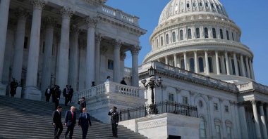 A general view as (L-R) House Speaker Mike Johnson, U.S. President Donald Trump and Irish Taoiseach Micheal Martin depart the U.S. Capitol following a &quot;Friends of Ireland&quot; luncheon, Washington, U.S., March 12, 2025 (Getty Images via AFP Photo)