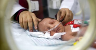 A prematurely-born infant receives care while lying in an incubator at the neonatal intensive care unit (NICU) at the Patient Friend&#039;s Benevolent Society hospital in Gaza City, Gaza, Palestine, Feb. 25, 2025. (AFP Photo)