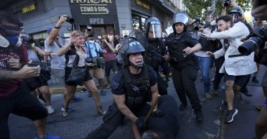 Riot police detain a demonstrator during a protest for better pensions for retirees, Buenos Aires, Argentina, March 5, 2025. (AP Photo)