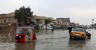 An autorickshaw drives through a flooded street, after heavy rainfall in Baghdad, Iraq, March 8, 2025. (Reuters Photo)