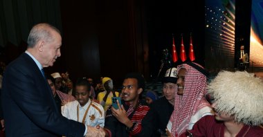 President Recep Tayyip Erdoğan shakes hands with international guests at the event, Ankara, Türkiye, March 13, 2025. (AA Photo)