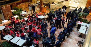 Demonstrators from the human rights organization Jewish Voice for Peace are detained by NYPD officers as they hold a civil disobedience action inside Trump Tower in New York, March 13, 2025. (AFP Photo)