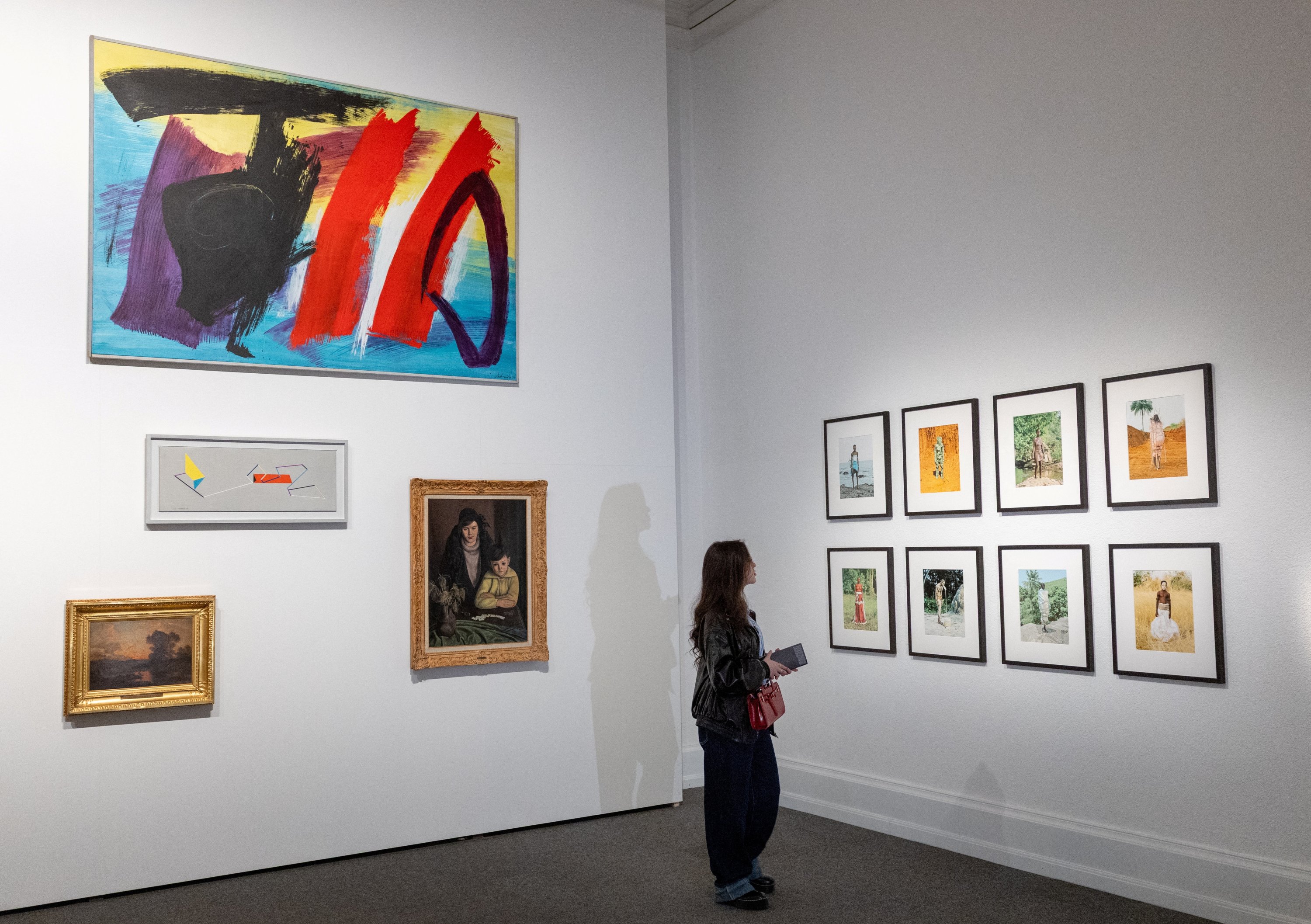 A patient, who is a part of a project in which doctors prescribe museum visits, looks at artworks in the Art and History Museum, Neuchatel, Switzerland, March 11, 2025. (Reuters Photo)