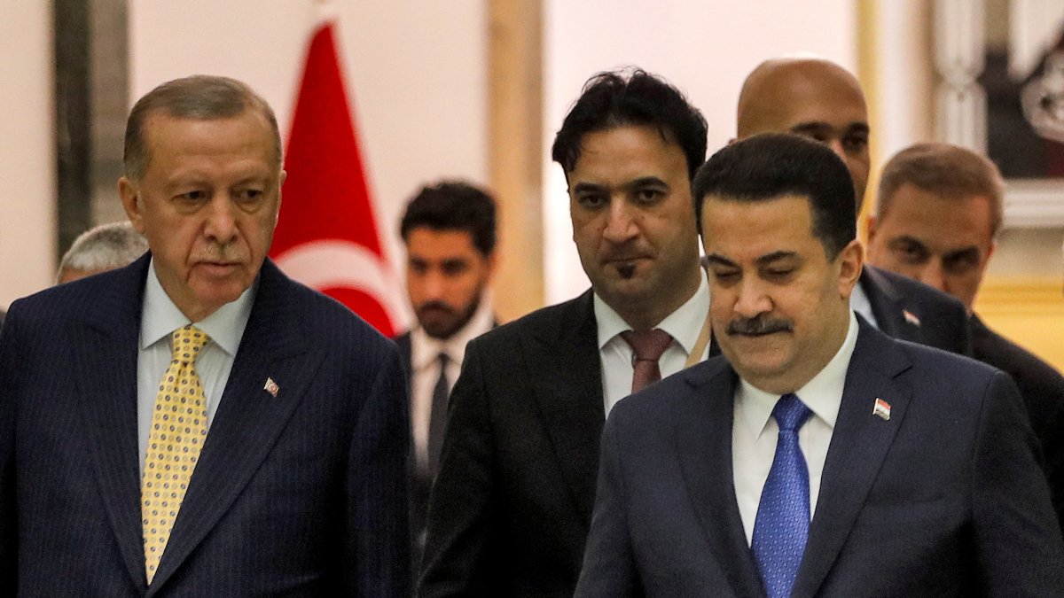 Iraqi Prime Minister Mohammed Shia Al Sudani (R) and President Recep Tayyip Erdoğan arrive for the signing of the "Development Road" framework agreement on security, economy and development, Baghdad, Iraq, April 22, 2024. (Reuters Photo)