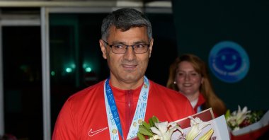 Veteran Turkish shooter Yusuf Dikeç arrives at the Esenboğa Airport after the European Shooting Championship, Ankara, Türkiye, March 13, 2025. (AA Photo)
