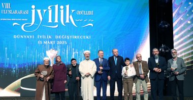 President Recep Tayyip Erdoğan poses for a photo with award winners at the 8th International Benevolence Awards ceremony, Ankara, Türkiye, March 13, 2025. (AA Photo)