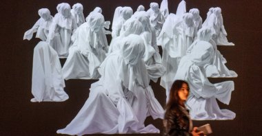 A patient, who is a part of a project in which doctors prescribe museum visits, walks past an artwork in the Art and History Museum, Neuchatel, Switzerland, March 11, 2025. (Reuters Photo)