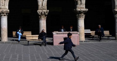 People sit in the courtyard of the Great Mosque of Diyarbakır (Ulu Camii) in the historical Sur district in Diyarbakır, southeastern Türkiye, Feb. 27, 2025. (AFP Photo)