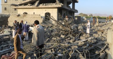 People stand on the rubble of a house hit by a U.S. strike in Saada, Yemen, March 16, 2025. (Reuters Photo)