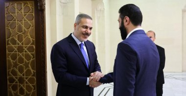 Turkish Foreign Minister Hakan Fidan (L) is welcomed by Syria&#039;s interim President Ahmed al-Sharaa (R), Damascus, Syria, March 13, 2025. (AFP Photo)