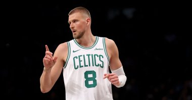 Celtics&#039; Kristaps Porzingis celebrates a 3-point shot during an NBA game against the Brooklyn Nets, New York City, U.S., March 15, 2025. (AFP Photo)