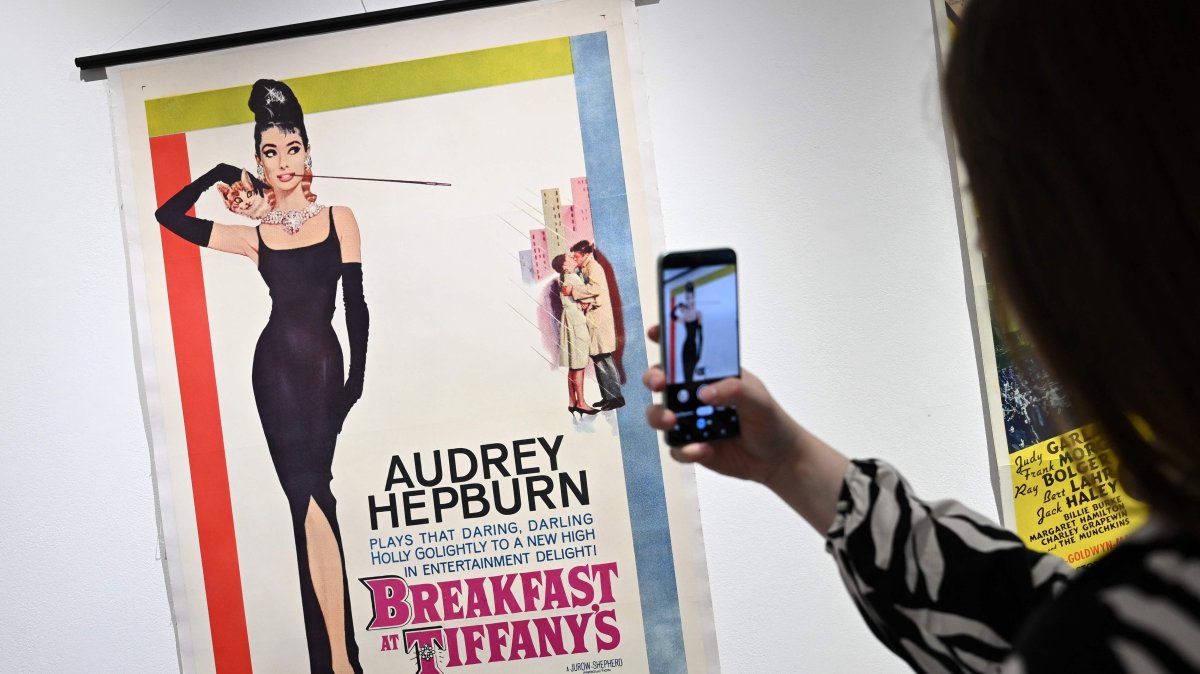 A poster for the film &#039;Breakfast at Tiffany&#039;s&#039; starring actor Audrey Hepburn, is pictured during a press preview ahead of the Cinema on Paper: The Dwight M. Cleveland Collection Movie Posters Auction, at Heritage Auctions, London, U.K., Feb. 27, 2025. (AFP Photo)