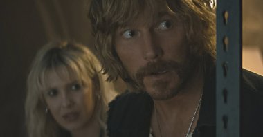 This image released by Netflix shows Millie Bobby Brown, left, and Chris Pratt in a scene from "The Electric State." (AP Photo)