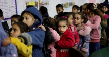 Palestinian children queue at a damaged school in Gaza City, Palestine, Feb. 25, 2025. (Reuters Photo)