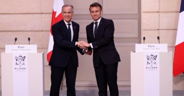 French President Emmanuel Macron (R) and Canadian Prime Minister Mark Carney shake hands after a joint statement, at Elysee Palace, during Carney&#039;s first foreign visit as prime minister, Paris, France, March 17, 2025. (Reuters Photo)