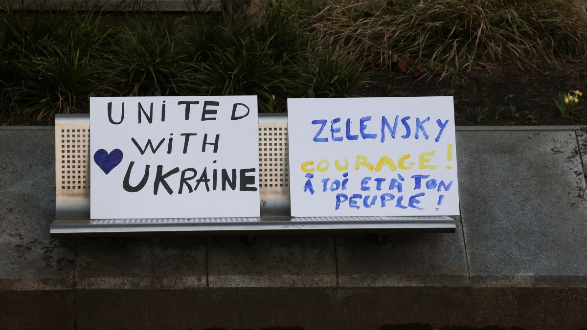 Placards are placed on a bench on the day Ukrainian activists urge European leaders to seize frozen Russian assets to fund Ukraine in its conflict with Russia, Brussels, Belgium, March 5, 2025. (Reuters Photo)