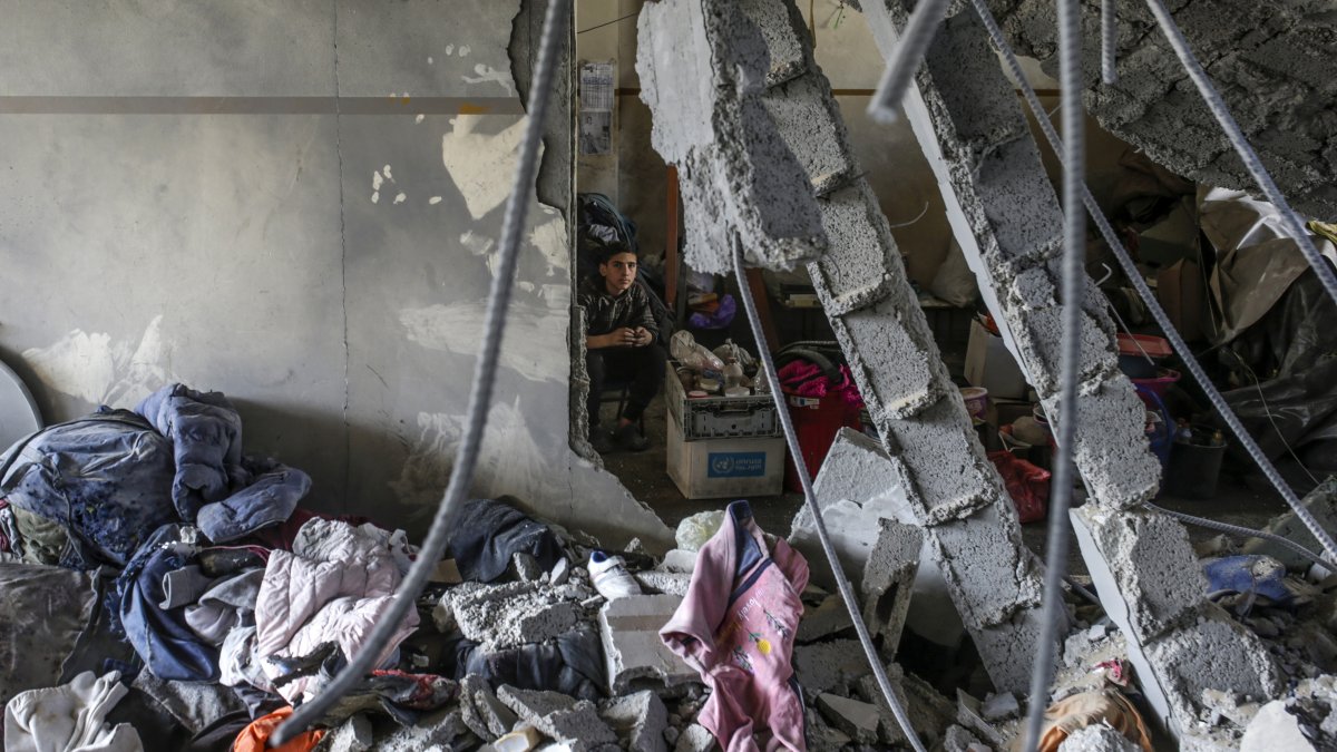 A Palestinian boy looks on inside a destroyed area of al Tabien school following Israeli airstrikes in Gaza City, Palestine, March 18, 2025. (EPA Photo)