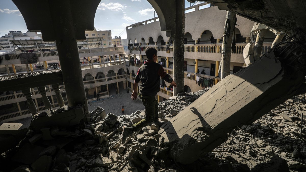 A Palestinian boy inspects a destroyed area of al Tabien school following Israeli airstrikes in Gaza City, Palestine, March 18, 2025. (EPA Photo)