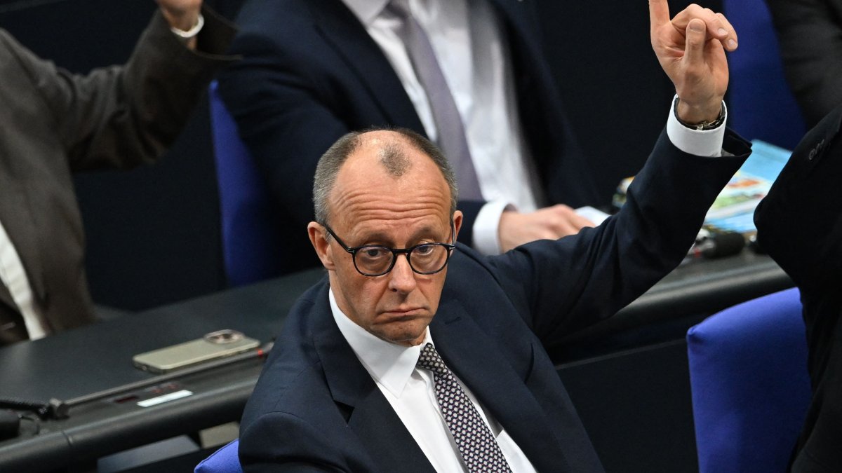 Friedrich Merz, leader of Germany&#039;s conservative Christian Democratic Union (CDU) party, raises his hand during a vote at a session of the Bundestag (lower house of parliament) in Berlin, Germany, March 18, 2025. (AFP Photo)