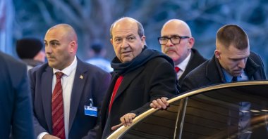 TRNC President Ersin Tatar (C) arrives at the Intercontinental Hotel for a dinner during the informal 5-plus-1 meeting on Cyprus, Geneva, Switzerland, March 17, 2025. (EPA Photo)