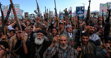 Yemenis brandish rifles and chant during a demonstration called for by the rebel Houthi movement in Sanaa, Yemen, March 17, 2025. (AFP Photo)