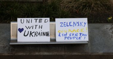 Placards are placed on a bench on the day Ukrainian activists urge European leaders to seize frozen Russian assets to fund Ukraine in its conflict with Russia, Brussels, Belgium, March 5, 2025. (Reuters Photo)