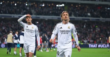 Real Madrid&#039;s Luca Modric (R) and Arda Guler leave the pitch dejected at full time during the UEFA Champions League League Phase match against Lille at Stade Pierre Mauroy, Lille, France, Oct. 2, 2024. (Getty Images Photo)