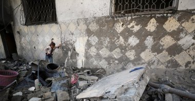 A Palestinian child stands at the site of an Israeli strike on a residential building in Jabalia in the northern Gaza Strip, Palestine, March 18, 2025. (Reuters Photo)